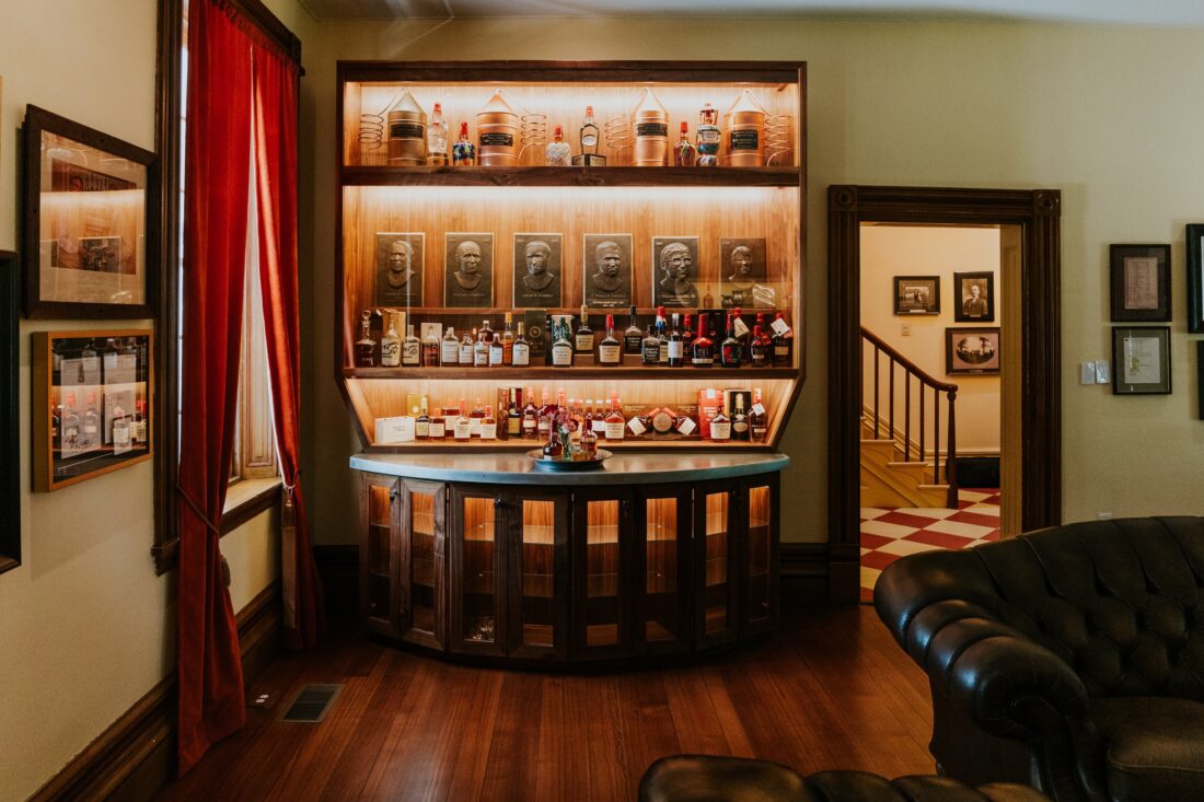 Inside a bourbon museum with shelves of bottles